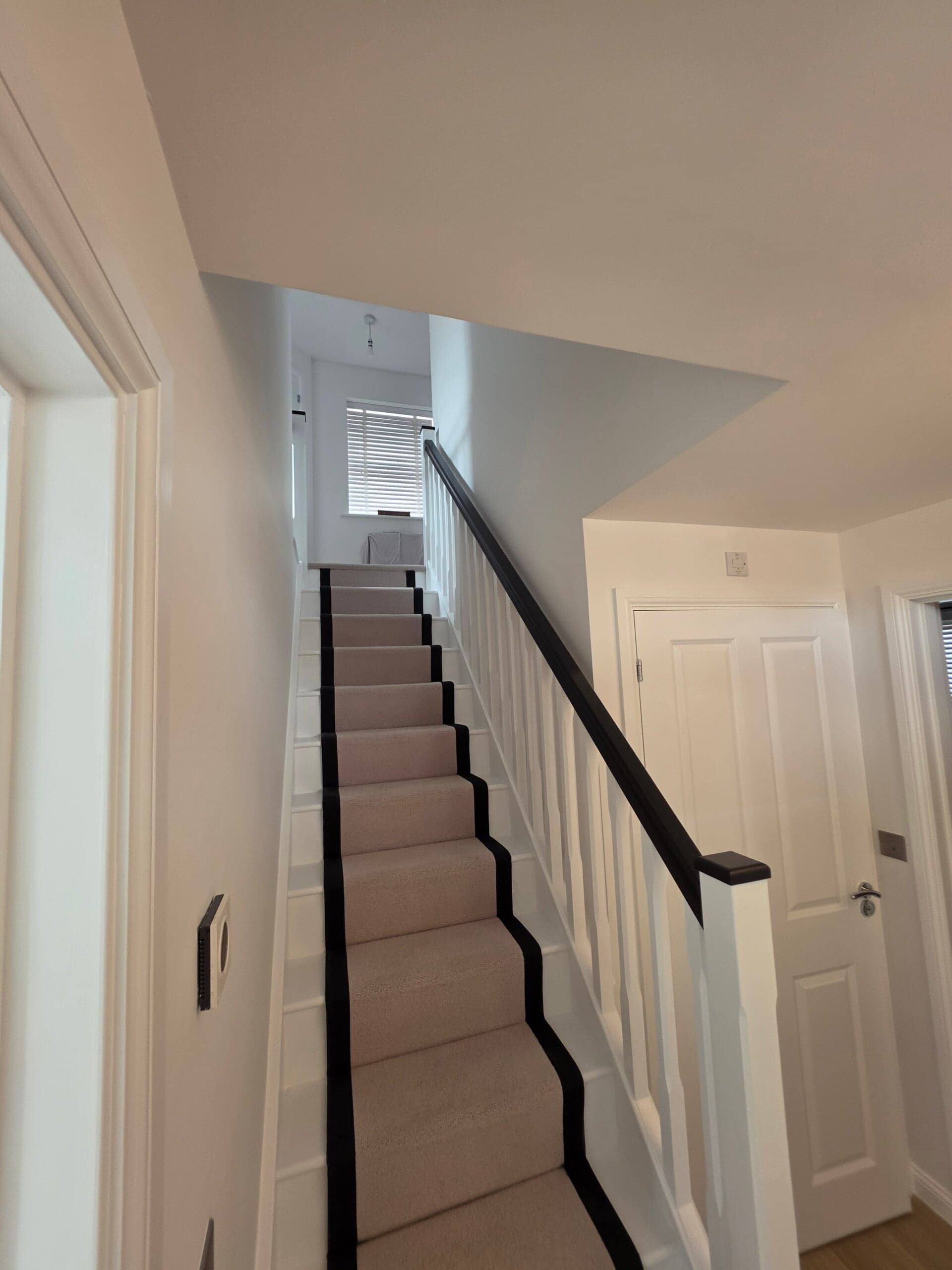 Freshly painted living room with a flawless smooth finish by PJW Decorators