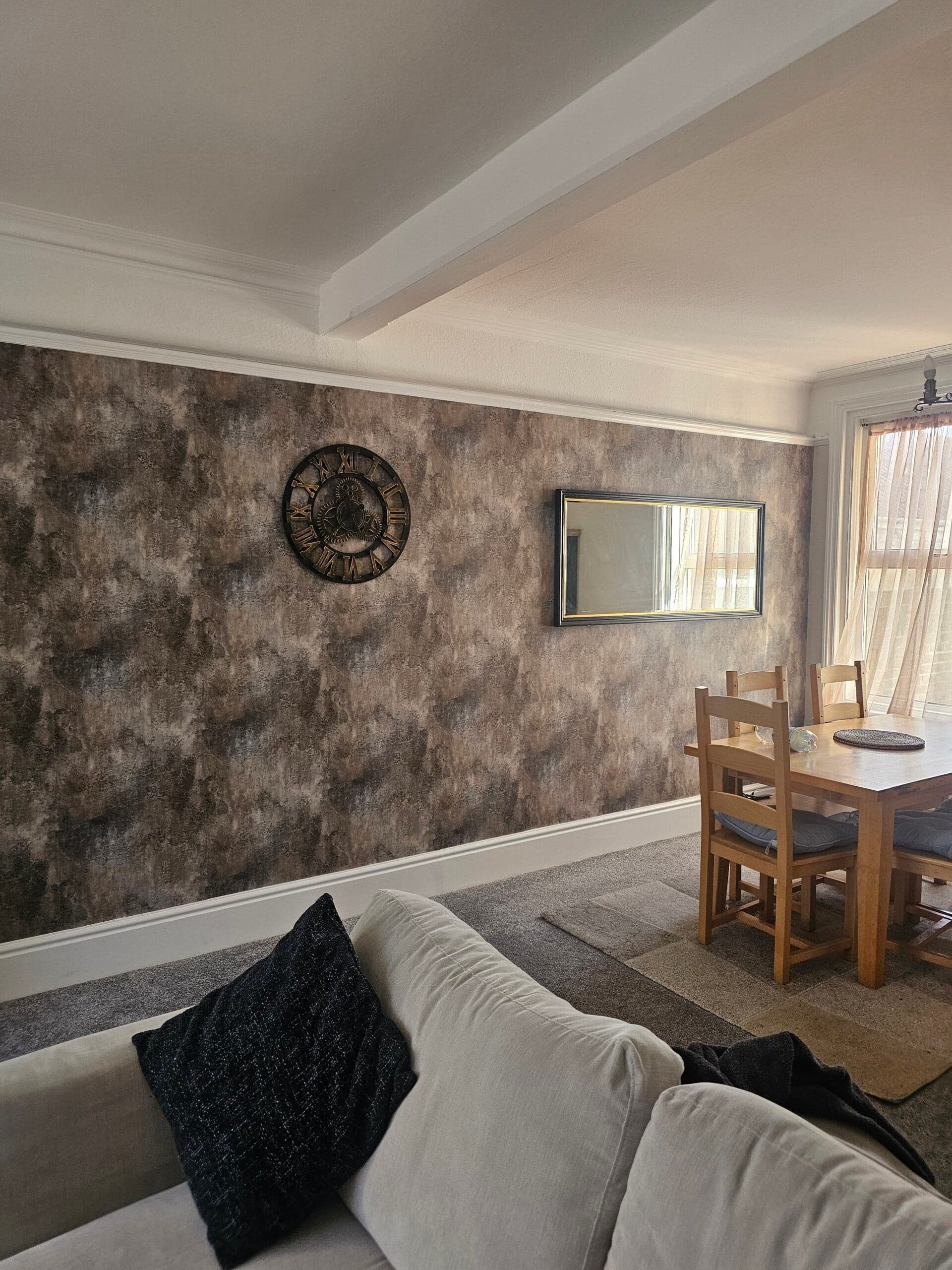 PJW Decorators painter completing a freshly decorated interior in East Sussex